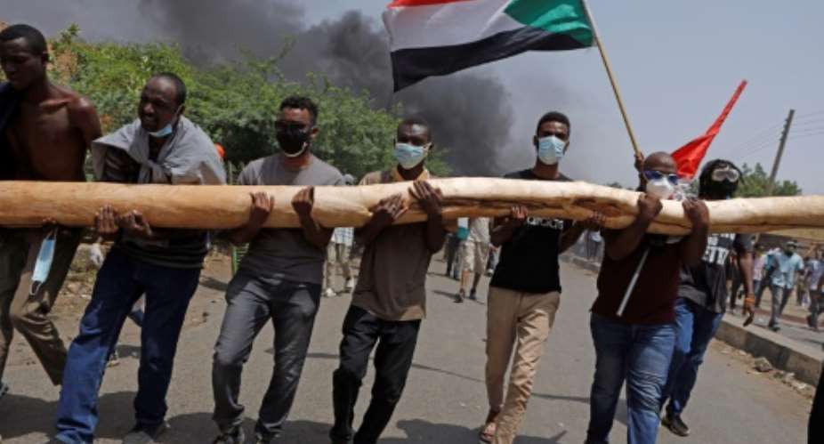 Sudanese anti-coup protesters take part in a demonstration against military rule in Khartoum on June 30, 2022.  By - AFP