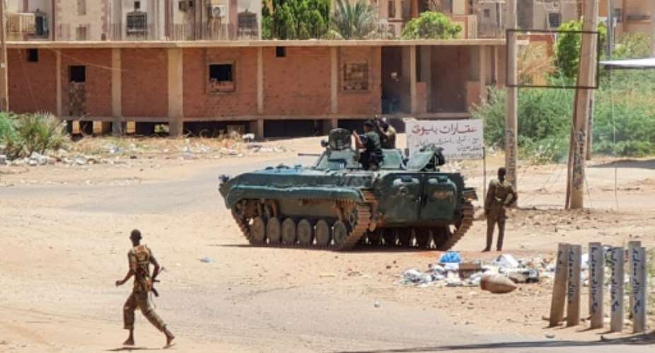 Sudanese Army soldiers and armoured vehicle in southern Khartoum on May 6, 2023.  By - AFP