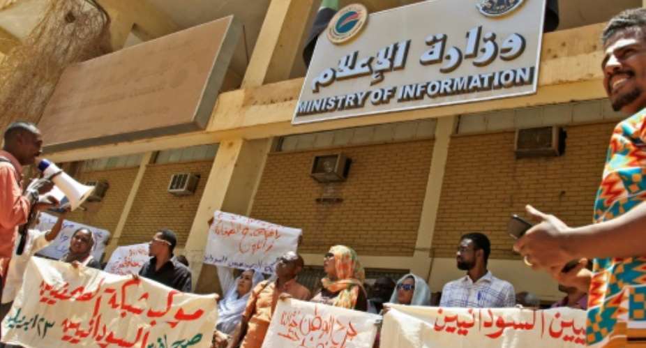 Sudanese journalists take part in a demonstration outside the information ministry.  By - AFP