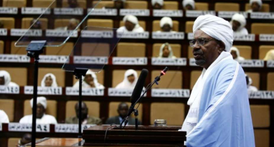 Sudanese President Omar al-Bashir addresses parliament in the capital Khartoum for the first time since he imposed a state of emergency across the country on February 22 in the face of anti-government protests.  By ASHRAF SHAZLY AFP