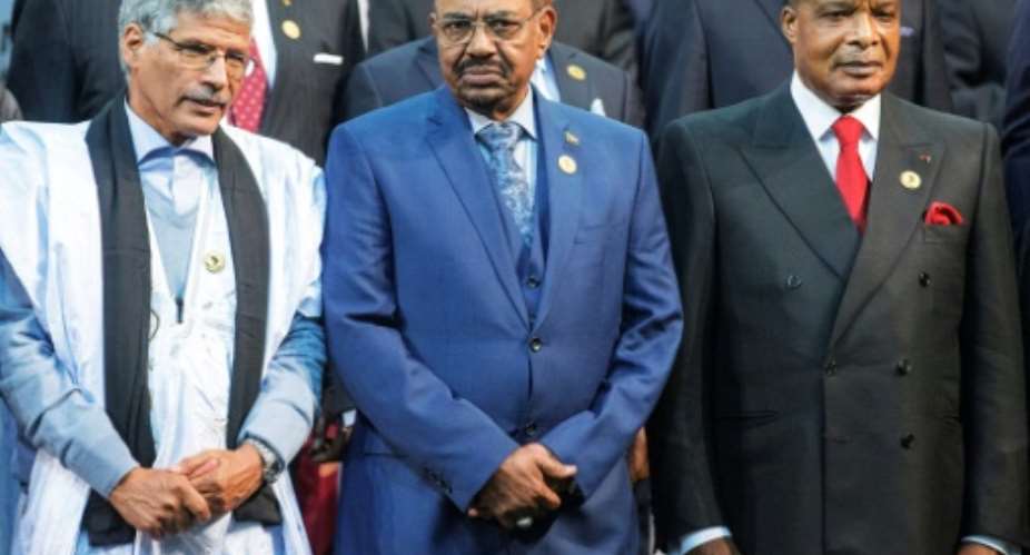 Sudanese President Omar al-Bashir centre attended the 2015 African Union Summit in South Africa, despite facing an arrest warrant from the International Criminal Court.  By Gianluigi Guercia AFPFile