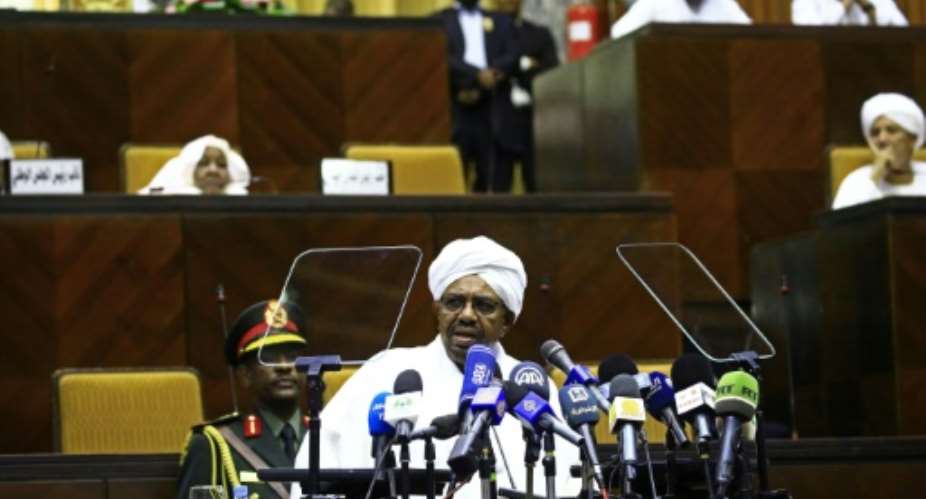 Sudanese President Omar al-Bashir delivers a speech to the members of the parliamentary body of the ruling National Congress Party on April 2, 2018 in the capital Khartoum.  By ASHRAF SHAZLY AFPFile