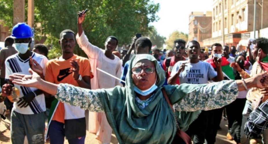Sudanese protesters call  for civilian rule and denounce the military in the capital Khartoum's twin city of Omdurman on Monday.  By - AFP