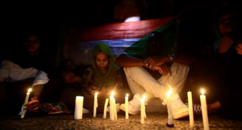 Sudanese protesters have held regular vigils to remember those killed in the June crackdown on a long-running sit-in outside army headquarters in Khartoum.  By ASHRAF SHAZLY AFPFile