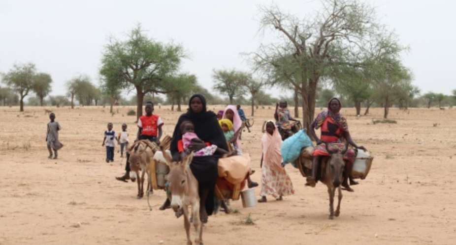 Sudanese refugees cross into Chad near Koufroun, Echbara, in May 2023: the latest arrivals are bring reports of new artocities in the countrys civil war.  By Gueipeur Denis SASSOU (AFP)