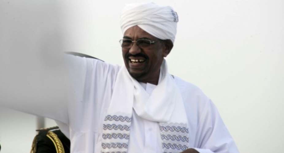 Sudanese President Omar al-Bashir waves as he arrives in Khartoum on June 15, 2015.  By Ebrahim Hamid AFPFile