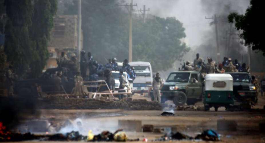 Sudan's military forcefully broke up a weeks-long sit-in outside Khartoum's army headquarters.  By ASHRAF SHAZLY AFP