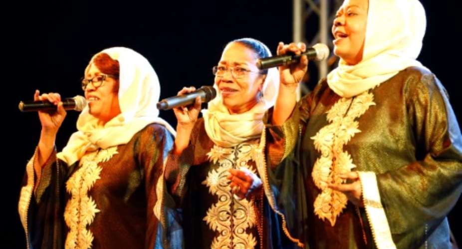 The Nightingales -- Sudan's best-loved girl band -- perform at a concert in Khartoum.  By Ashraf Shazly AFP