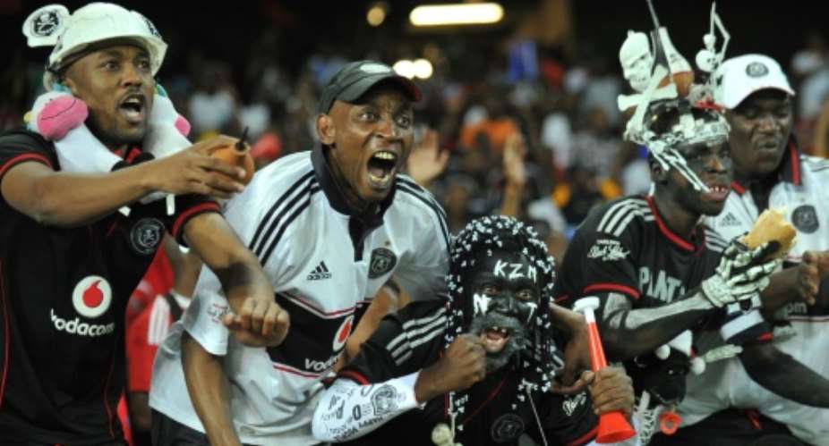 Orlando Pirates supporters celebrate on November 2, 2013.  By Alexander Joe (AFP/File)