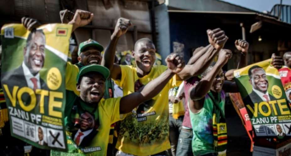 Supporters celebrated after Zimbabwe's President Emmerson Mnangagwa was declared the winner in the country's landmark election.  By Luis TATO AFP