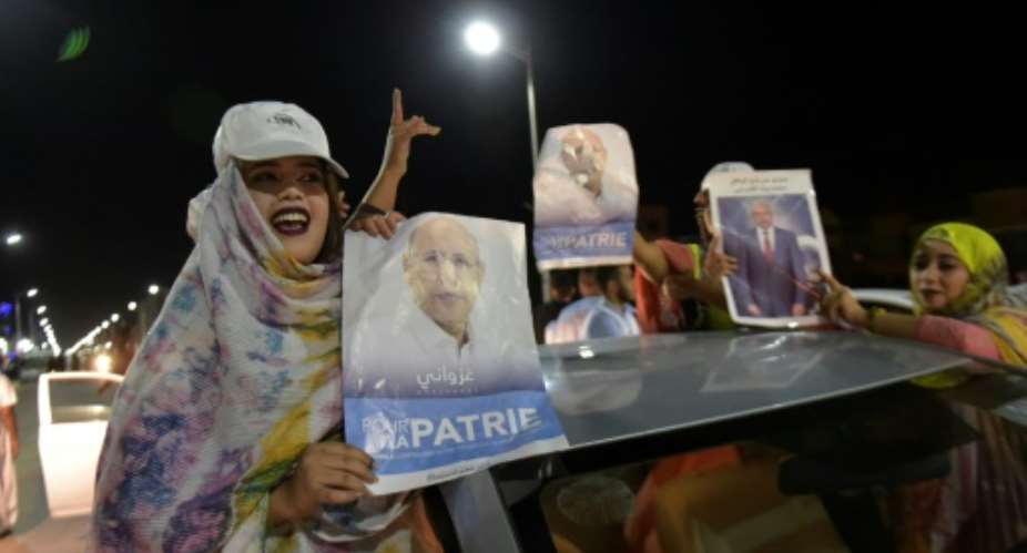 Supporters celebrated Mohamed Ould Ghazouani's victory in Mauritania's presidential election which is set to be the first democratic transfer of power in the country.  By Sia KAMBOU AFP