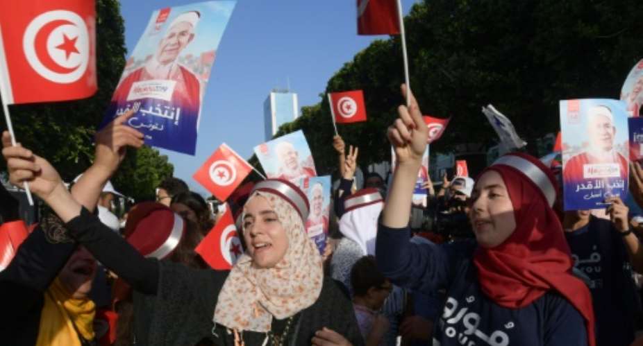 Supporters of Ennahdha candidate Abdelfattah Mourou attend an event on Thursday, as campaigning came to a close in Tunisia's presidential poll.  By FETHI BELAID AFPFile