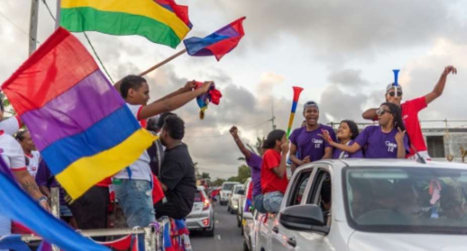 Supporters of Navin Ramgoolams alliance celebrate in Mauritius.  By Laura Morosoli (AFP)