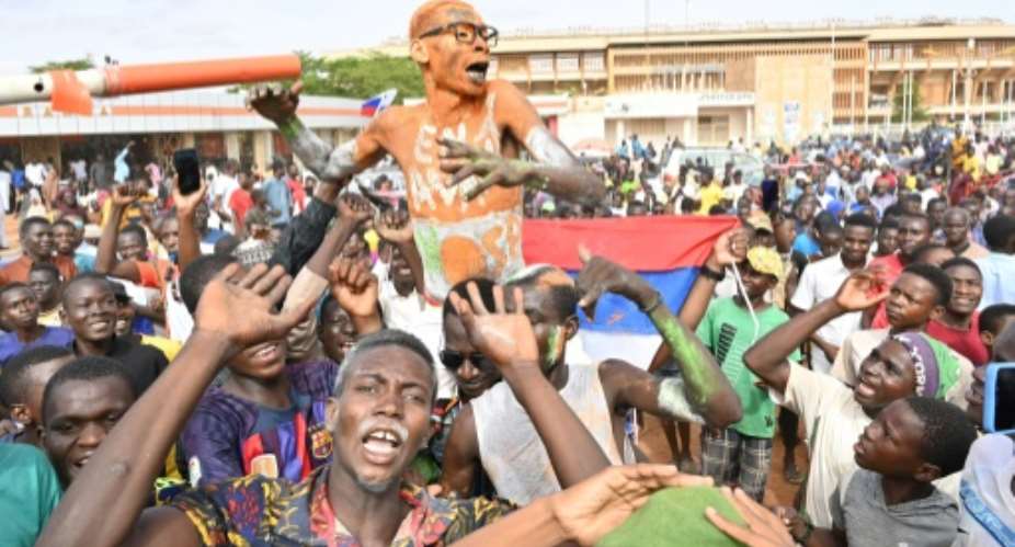 Supporters of Nigers ruling junta gathered in Niamey.  By - (AFP)