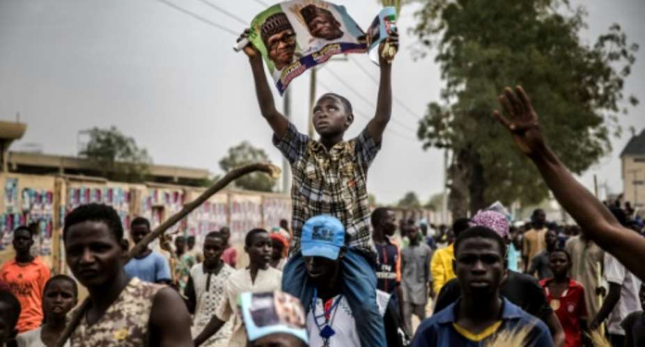 Supporters of President Muhammadu Buhari celebrated his election victory last month, but the violence that marred some polls that have had to be re-run appeared to have returned Saturday.  By Luis TATO AFP