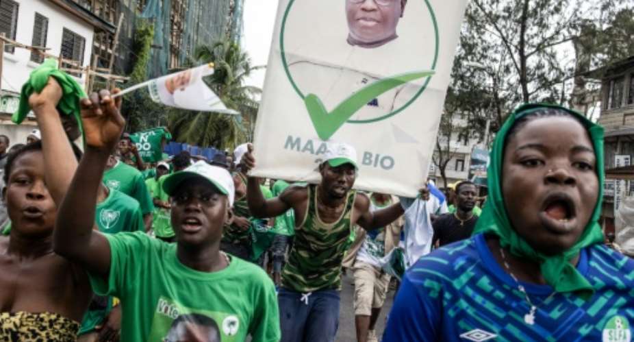 Supporters of Sierra Leone President Julius Maada Bio after his June election, whose results are questioned by the US ambassador.  By JOHN WESSELS AFP