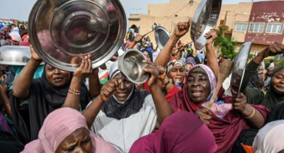 Supporters of the coup rallied outside the French base near Niamey on Wednesday to demand that French troops leave Niger.  By - AFP