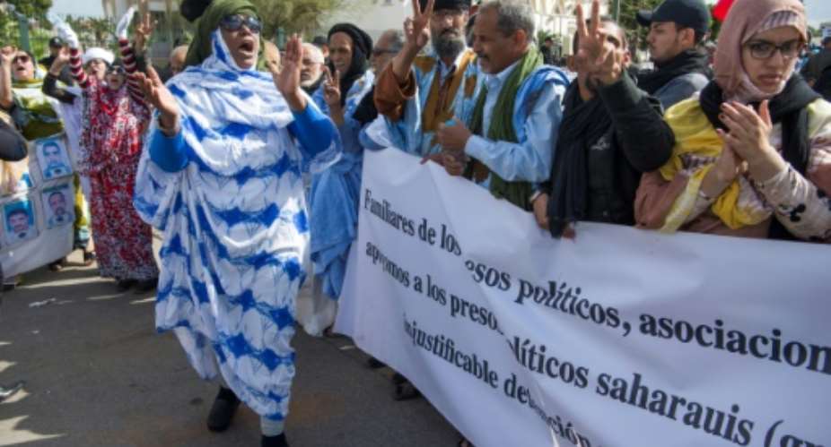 Supporters of the Western Sahara's Polisario Front shout slogans during a demonstration outside the court in Sale on March 13, 2017.  By FADEL SENNA AFPFile