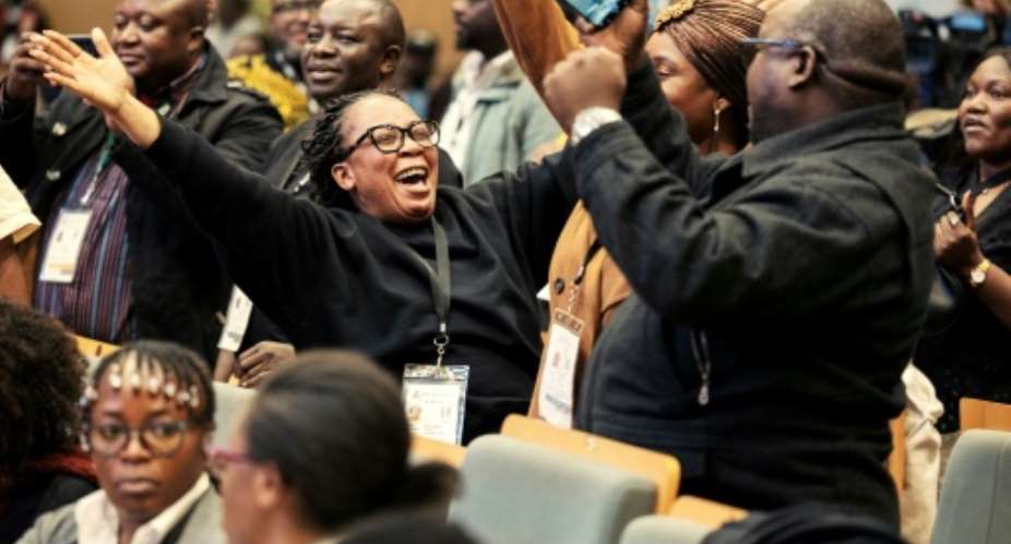 Supporters of Zambian President Hakainde Hichilema celebrated after election results showed he had won a second term.  By GIANLUIGI GUERCIA (AFP)