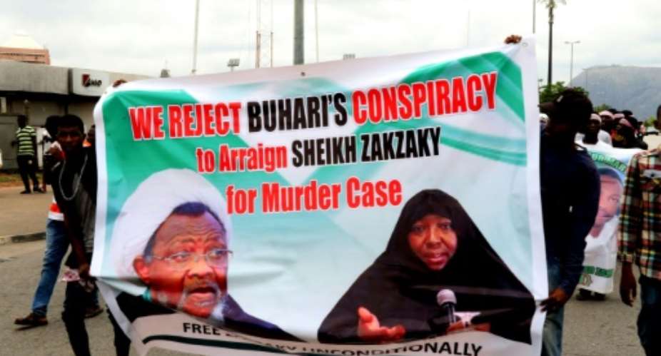 Supporters press for the release of Nigerian Shiite Muslim cleric Ibrahim Zakzaky on May 14, 2018, a day before his appearance in court to face criminal charges.  By PHILIP OJISUA AFPFile