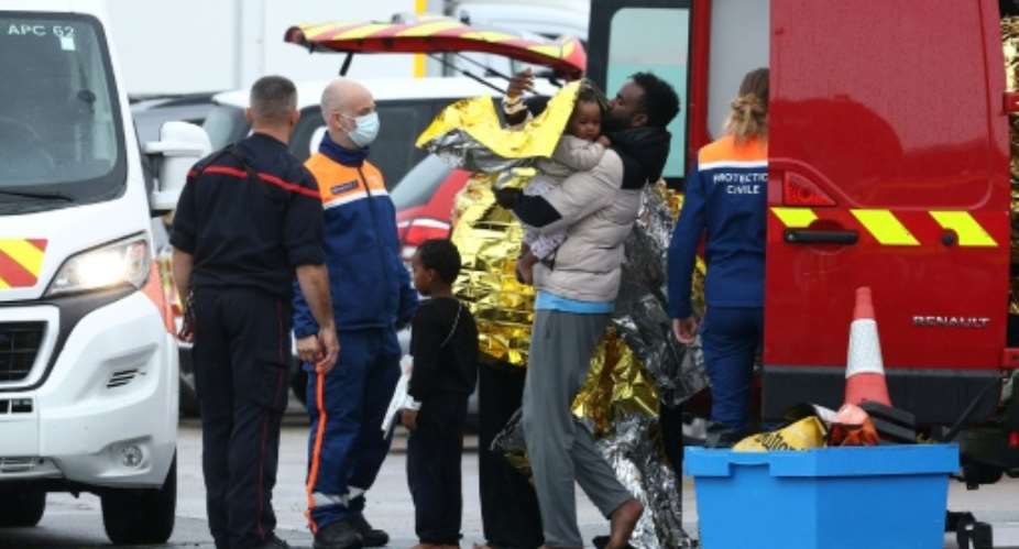 Survivors disembarked a rescue boat at the port of Calais, some on stretchers and in wheelchairs, many wrapped in emergency blankets.  By Sameer AL-DOUMY (AFP)