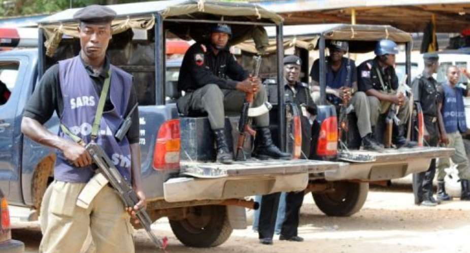 Policemen sits in their vehicles in Jos, Plateau State in 2010.  By Pius Utomi Ekpei AFPFile