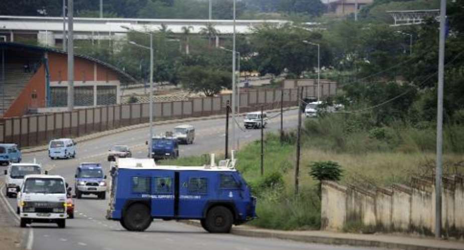 File picture shows police C arriving to disperse a group of activists in Manzini, Swaziland on April 13, 2011.  By Stephane de Sakutin AFPFile