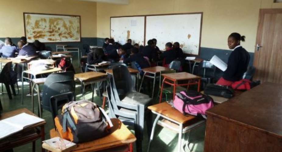 A group of pupils sit in an empty geography class at St Marks High School in Mbabane on July 24.  By Johannes Myburgh (AFP/File)