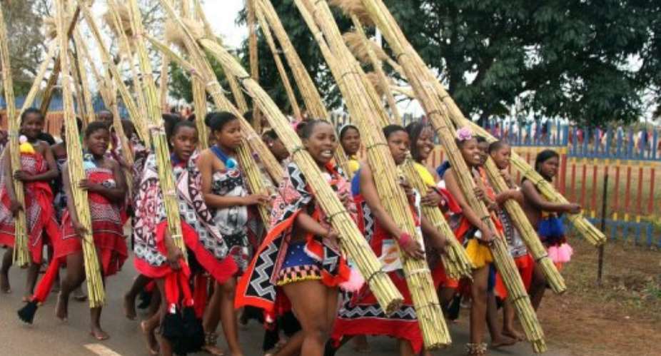 Unmarried women from Swaziland dance carrying bundles of reeds near the capital, Mbabane, in 2011.  By Jinty Jackson (AFP/File)