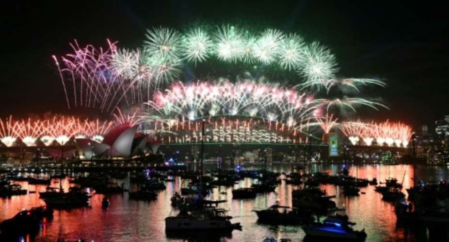 Sydney rang in the New Year with its customary fireworks display after pausing for a minute of silence to honour victims of the Bondi Beach mass shooting barely two weeks earlier.  By Saeed KHAN (AFP)