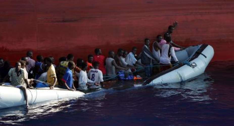 Malta's Navy rescues a sinking boatload of migrants on July 31, 2008.  By Ho AFPFile