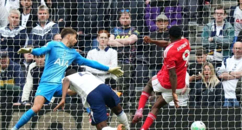Taiwo Awoniyi (R) scores to clinch a 3-0 win for Nottingham Forest at Tottenham Hotspur..  By CARLOS JASSO (AFP)