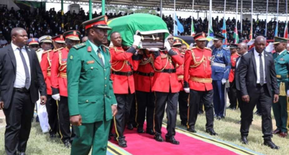 Tanzania Police Defense Force TPDF personnel carry the coffin of the late President Leaders from across Africa attended Magufuli's state funeral a day after the stampede.  By STR AFPFile