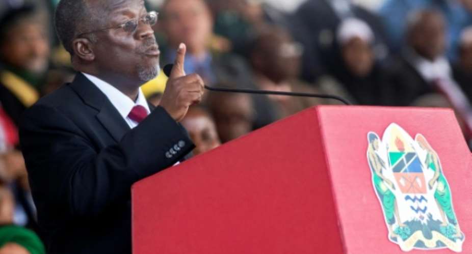 Tanzanian President John Magufuli, seen here at his swearing-in ceremony in November 2015, has cracked down on media critics.  By Daniel Hayduk AFP