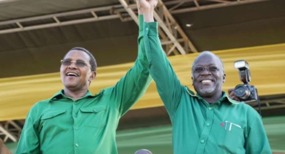 Outgoing Tanzanian president Jakaya Kikwete L introduces presidential candidate John Magufuli at a rally by ruling party Chama Cha Mapinduzi in Dar es Salaam on October 23, 2015.  By Daniel Hayduk AFPFile
