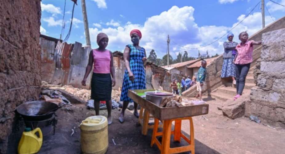Teenager Bella Achieng works alongside her mother in Nairobi after the school year was cancelled in Kenya due to the coronavirus.  By TONY KARUMBA AFP