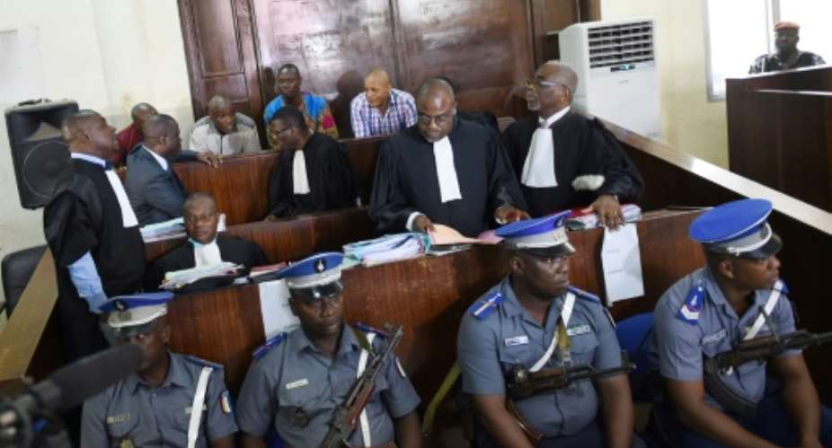 Ten men, most of them soldiers, are on trial for kidnapping and killing four leading foreign businessmen from the Novotel hotel during fighting in Abidjan in April 2011.  By SIA KAMBOU AFPFile