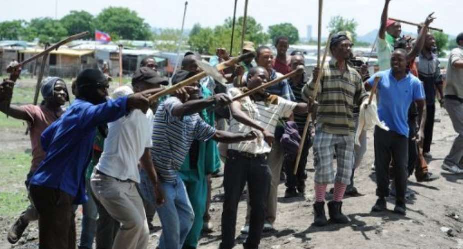 Striking platinum miners protest in Rustenberg on October 30, 2012.  By  (AFP/File)