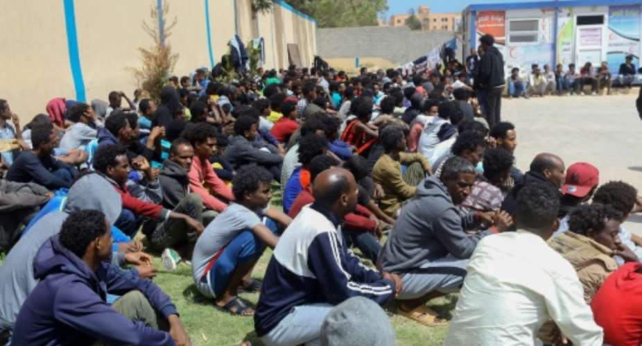Tens of thousands of refugees and asylum-seekers -- similar to these African migrants who fled Libyan battle zones, pictured April 2019 at at a detention center in Zawiya -- have been stranded in chaos-wracked Libya.  By Mahmud TURKIA AFPFile