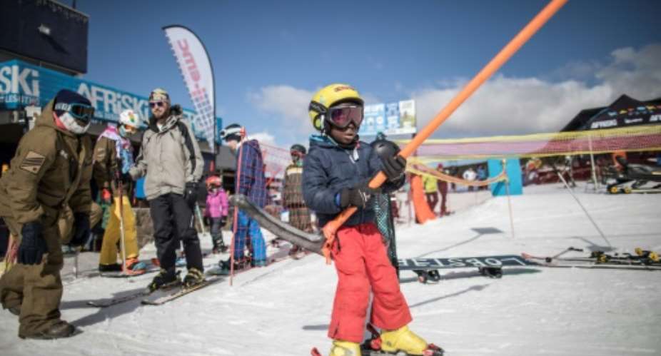 Thabang Mabari, 10, the son of Afriski employees, has been taking to the slopes since the age of three.  By MARCO LONGARI AFP