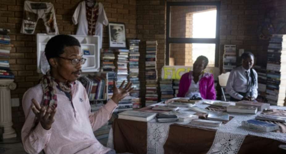 Thami Mazibuko has turned the upper level of his childhood home into a bookstore and library.  By EMMANUEL CROSET AFP