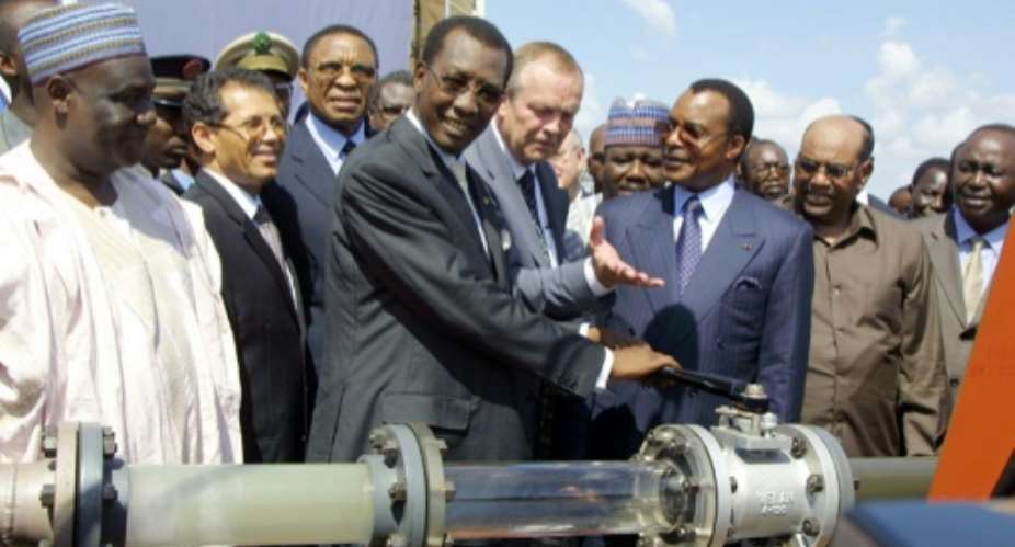 The 1,000-kilometre 600-mile pipeline from Chad to Cameroon was launched in 2003 by then-president Idriss Deby Itno, centre.  By DESIREY MINKOH AFP