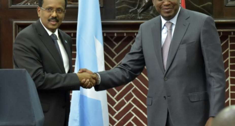 The agreement followed a meeting between President Uhuru Kenyatta R and his Somali counterpart, Mohamed Abdullahi Mohamed L.  By SIMON MAINA AFPFile