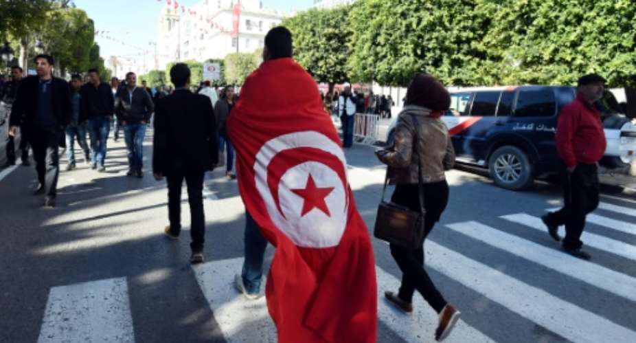 The anniversary of Tunisia's 2011 revolution is marked with rallies.  By FETHI BELAID AFPFile