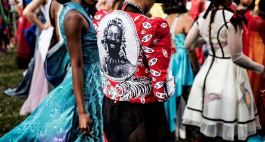 The annual Durban July handicap race attracts one of the continent's most fashion-conscious crowds.  By MARCO LONGARI AFP