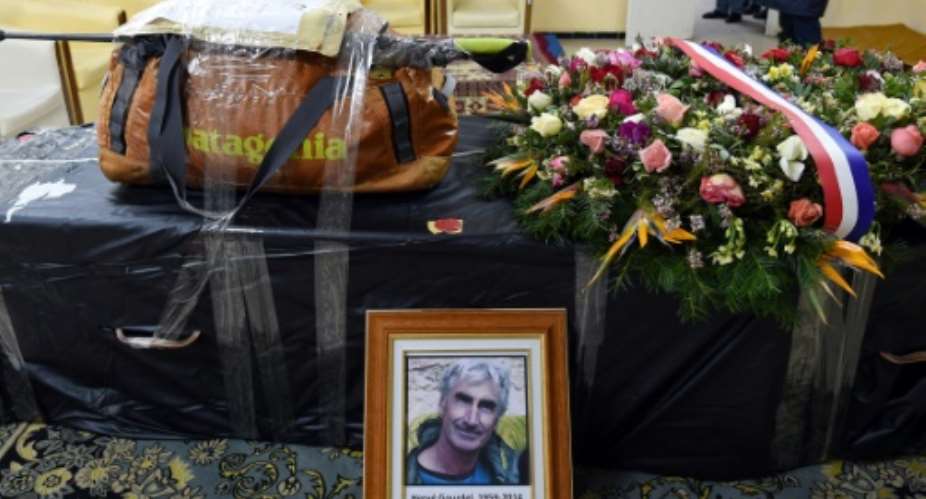The backpack and walking stick of French mountaineer Herve Gourdel, who was kidnapped and beheaded by jihadists in Algeria in 2014, sits on his coffin before it was flown to Paris, in this picture taken on January 26, 2015.  By Farouk Batiche (AFP/File)
