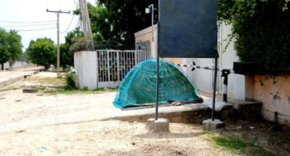 The barred entrance to the Maiduguri offices of the Mercy Corps humanitarian group which the Nigerian army closed in September.  By AUDU MARTE AFPFile