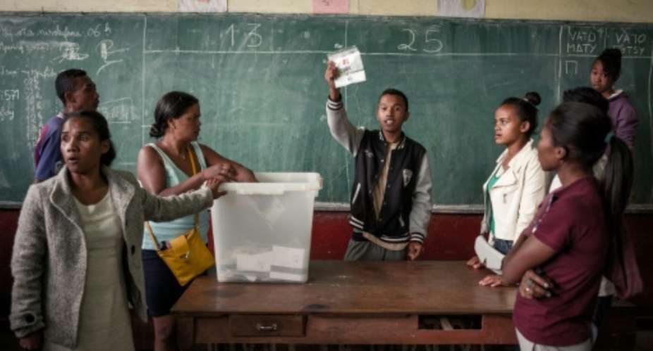 The big count: Early vote counting has been marred by accusations of fraud as both candidates claim victory.  By RIJASOLO (AFP)