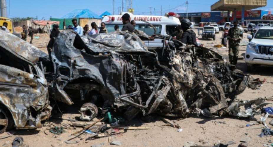 The blast left the wreckage of surrounding vehicles at the busy checkpoint and crossroads.  By Abdirazak Hussein FARAH AFP