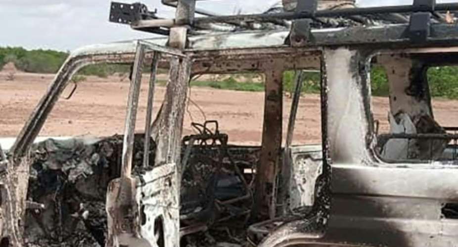 The burnt-out vehicle of eight people, including six French citizens, that was attacked by unidentified gunmen in southwest Niger.  By  AFP